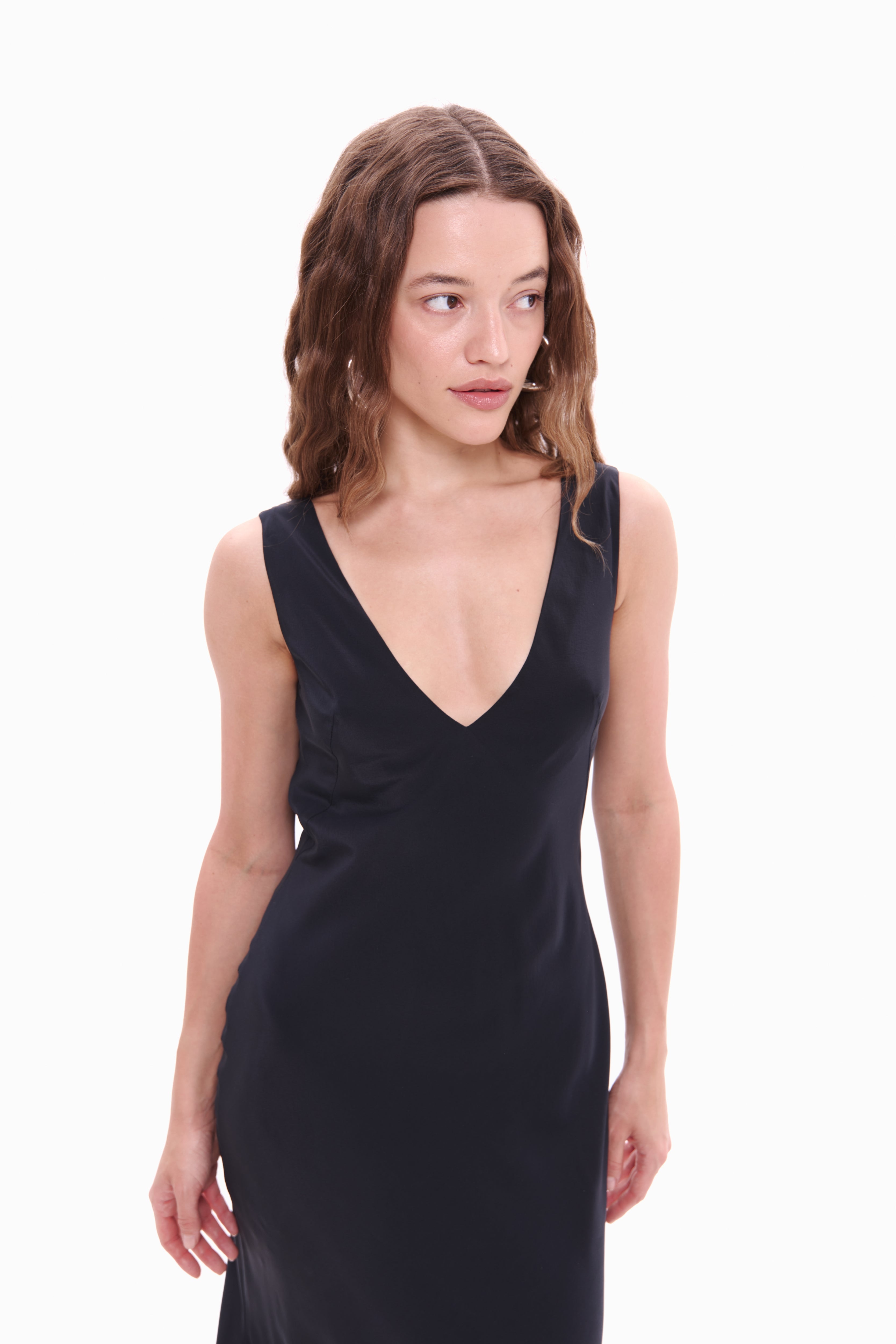 Woman wearing a black dress on a white background
