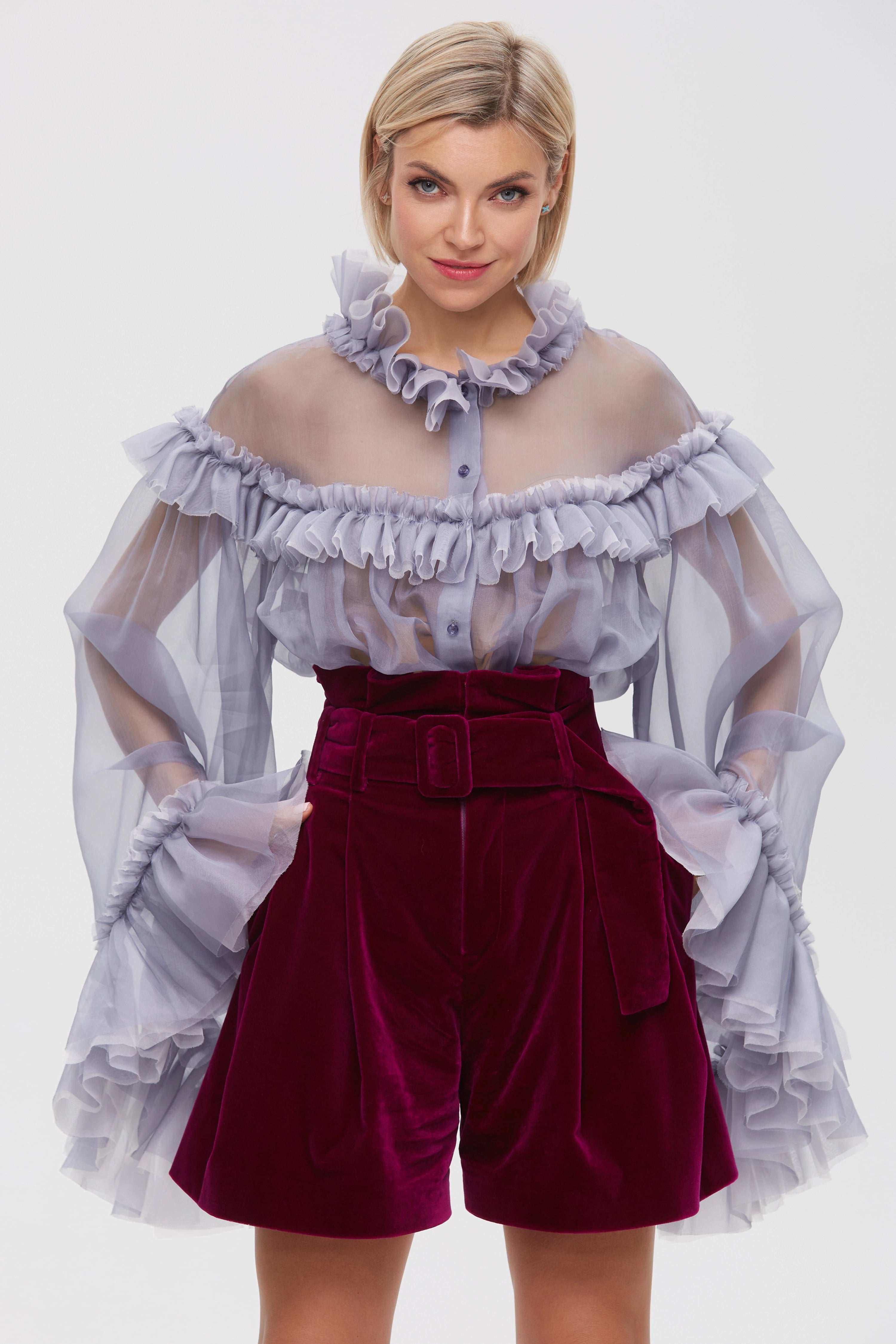 Woman wearing Burgundy Icon Shorts from Mimaussy Paris, studio front view against a plain background