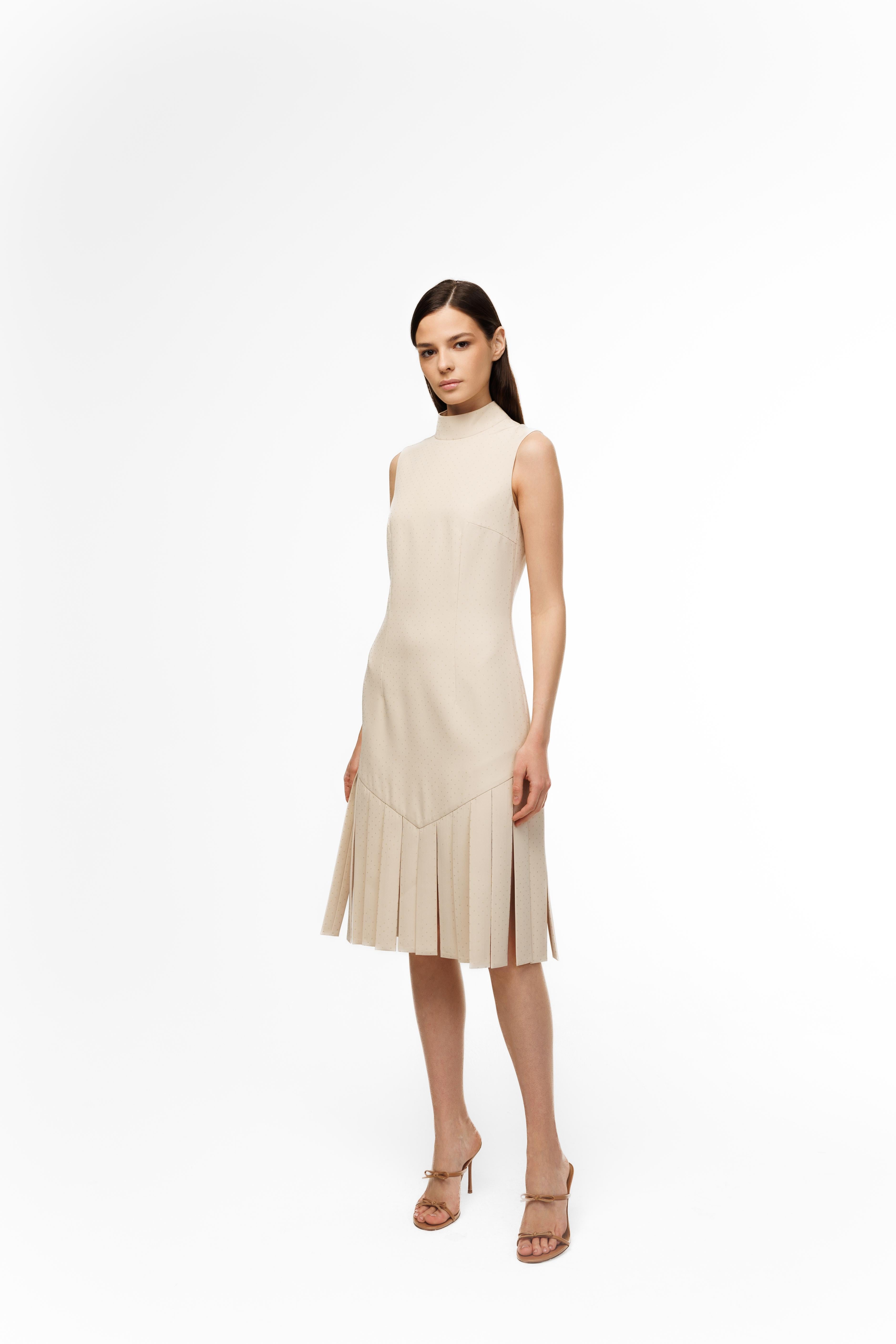 Woman wearing a beige dress on a white background