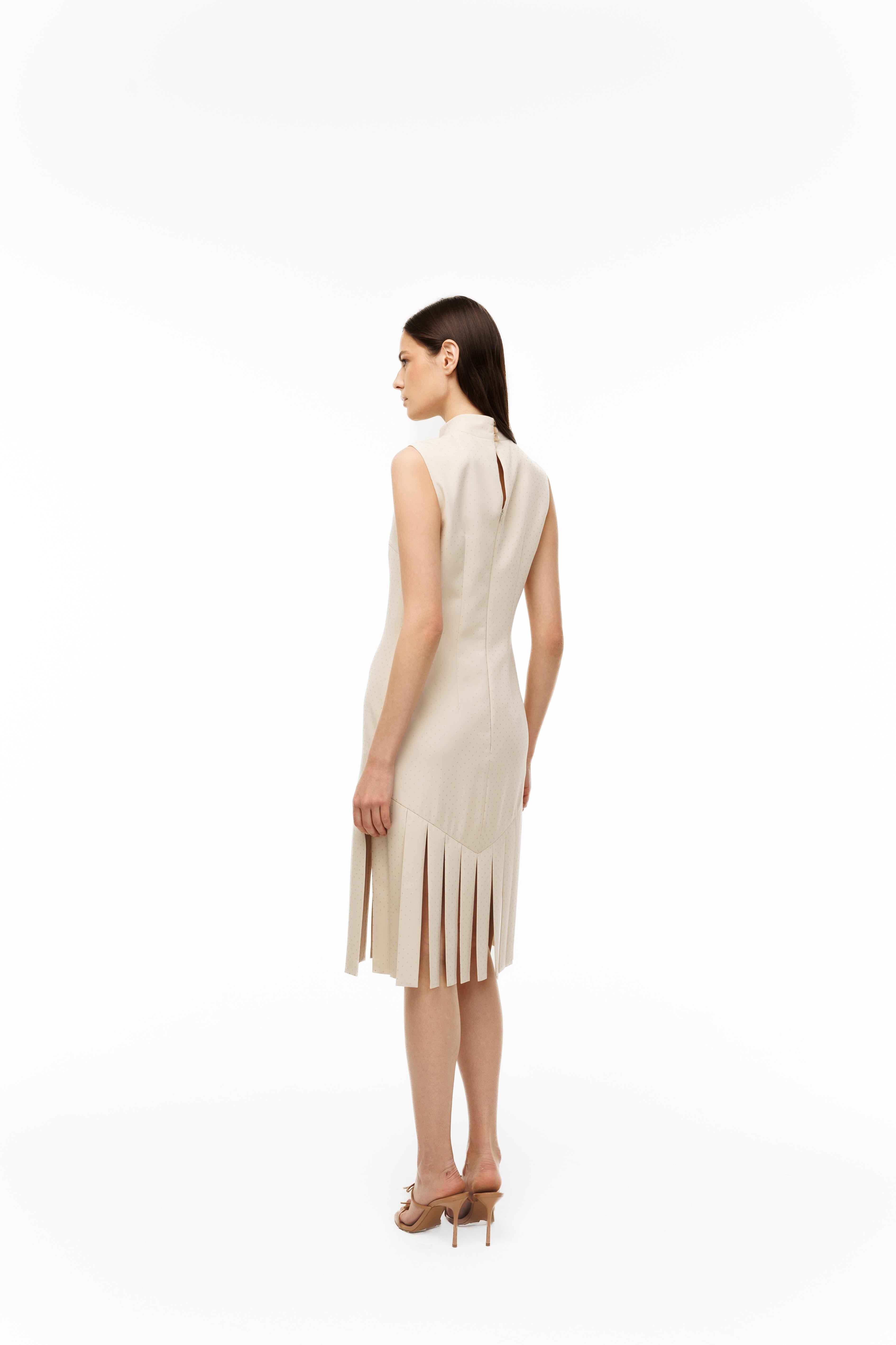 Woman wearing a beige dress on a white background