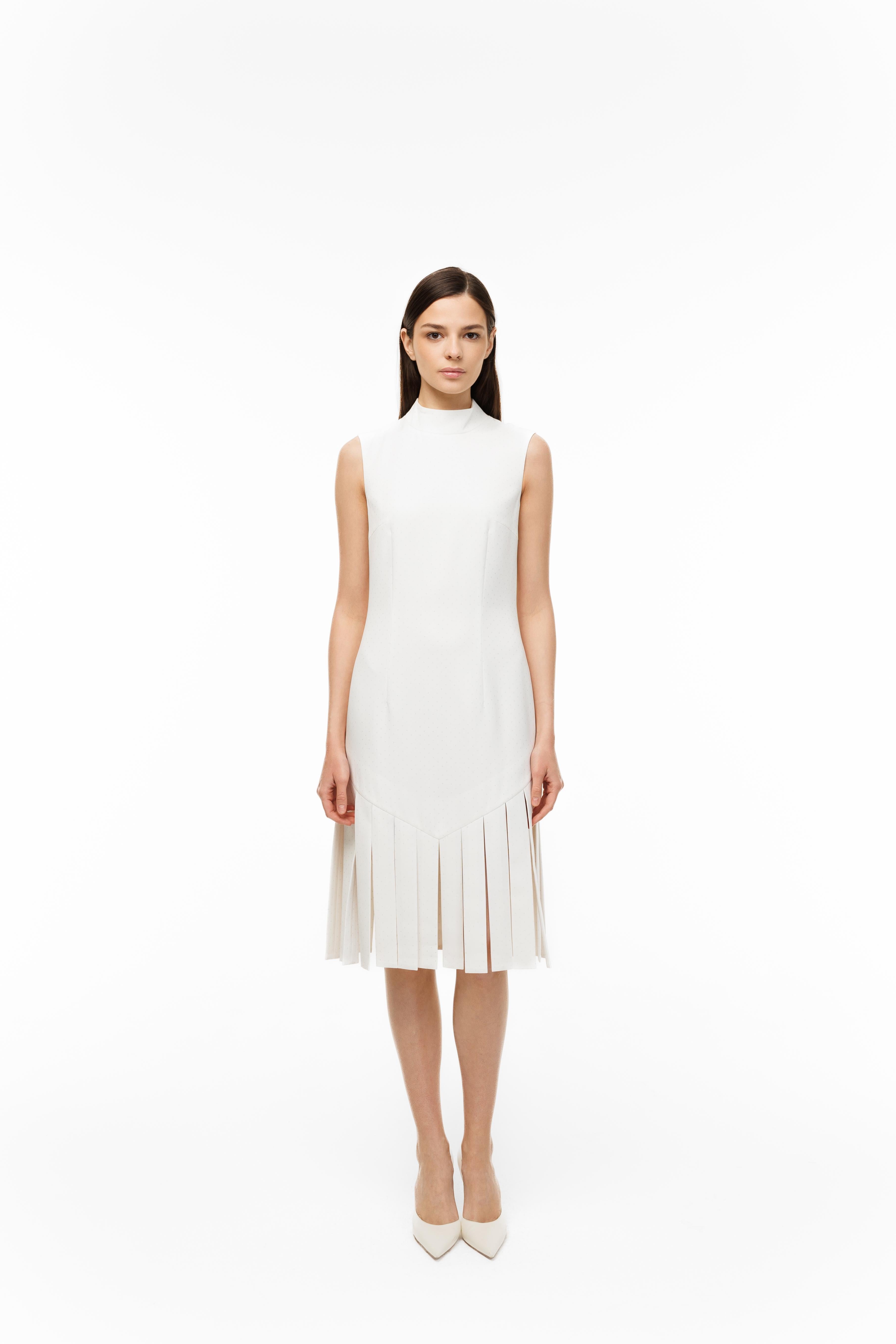 Woman wearing a white dress on a white background