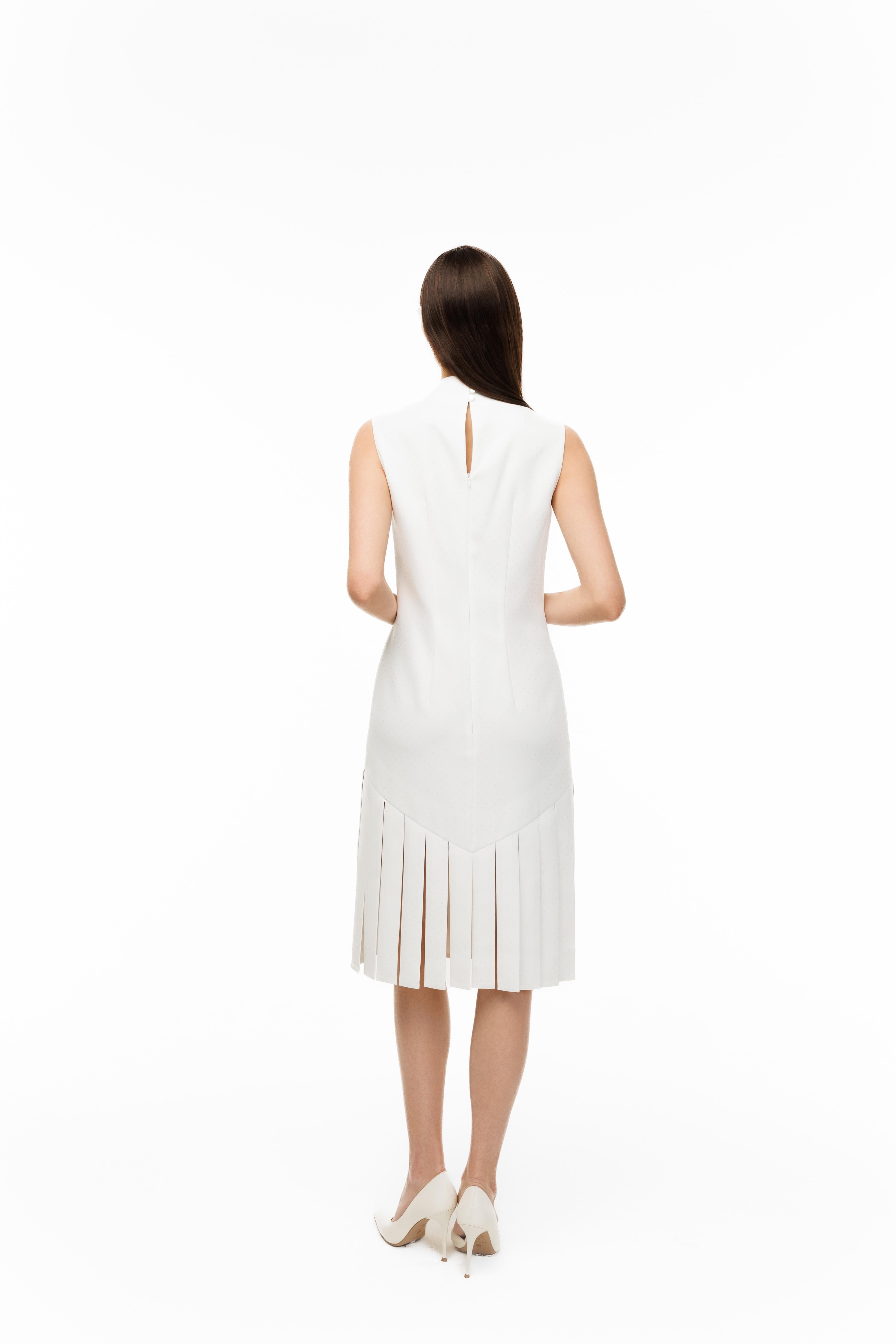 Woman wearing a white dress on a white background