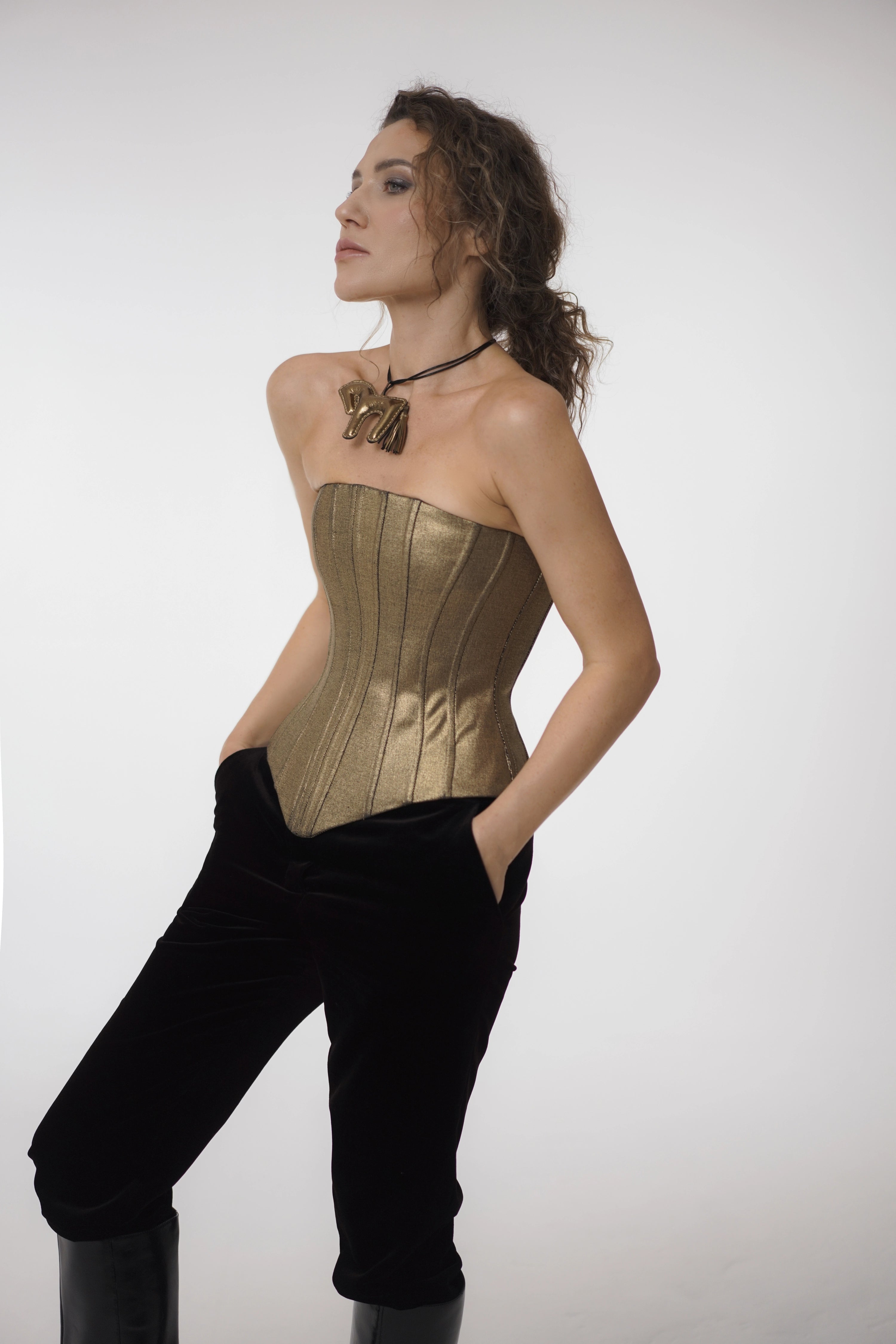 Woman wearing Gold Skin Denim Corset from Mimaussy Paris, studio front view against a plain white background