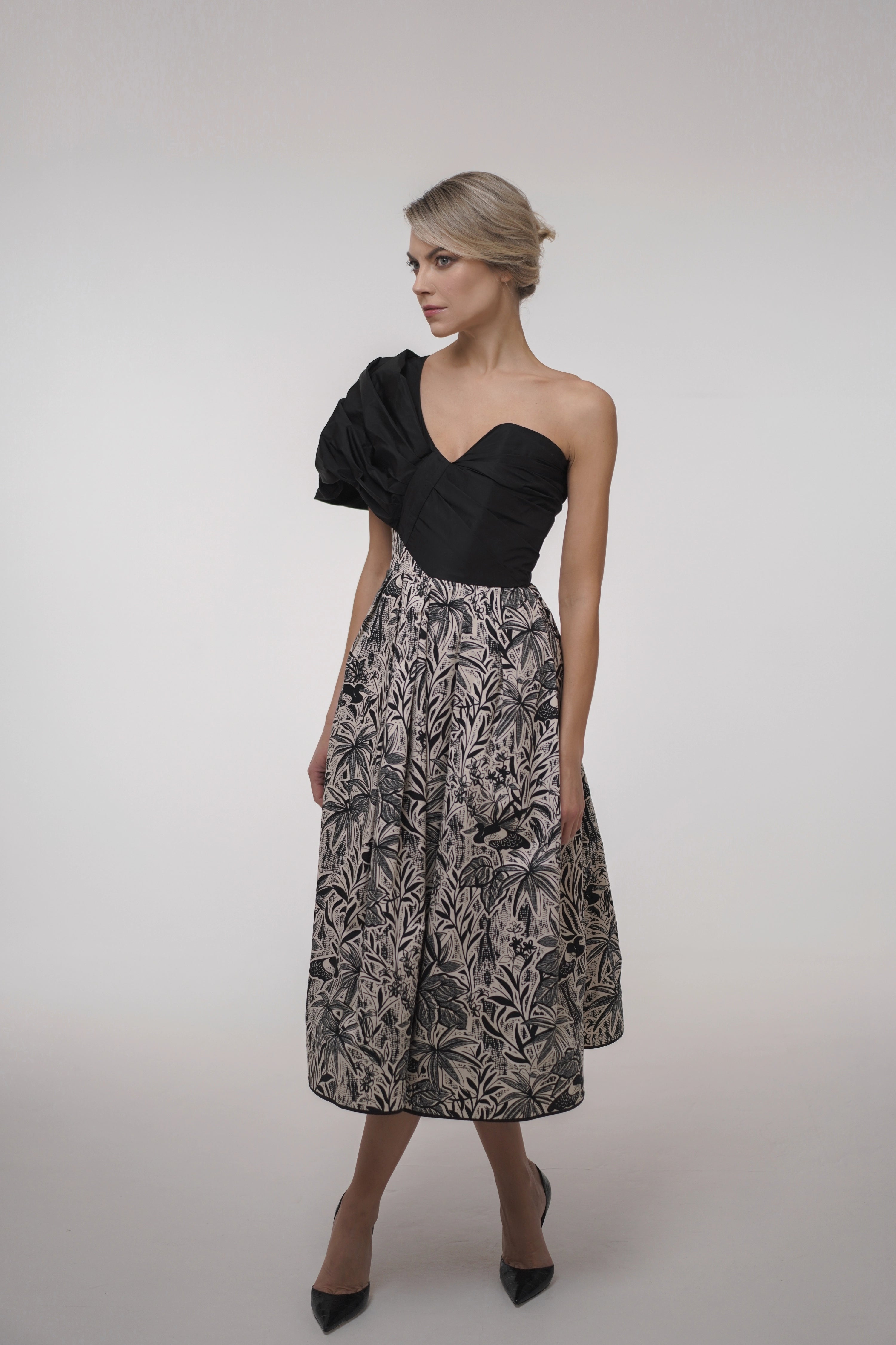 Woman wearing La Muse Nocturne Dress from Mimaussy Paris, front view in studio setting against a plain white background