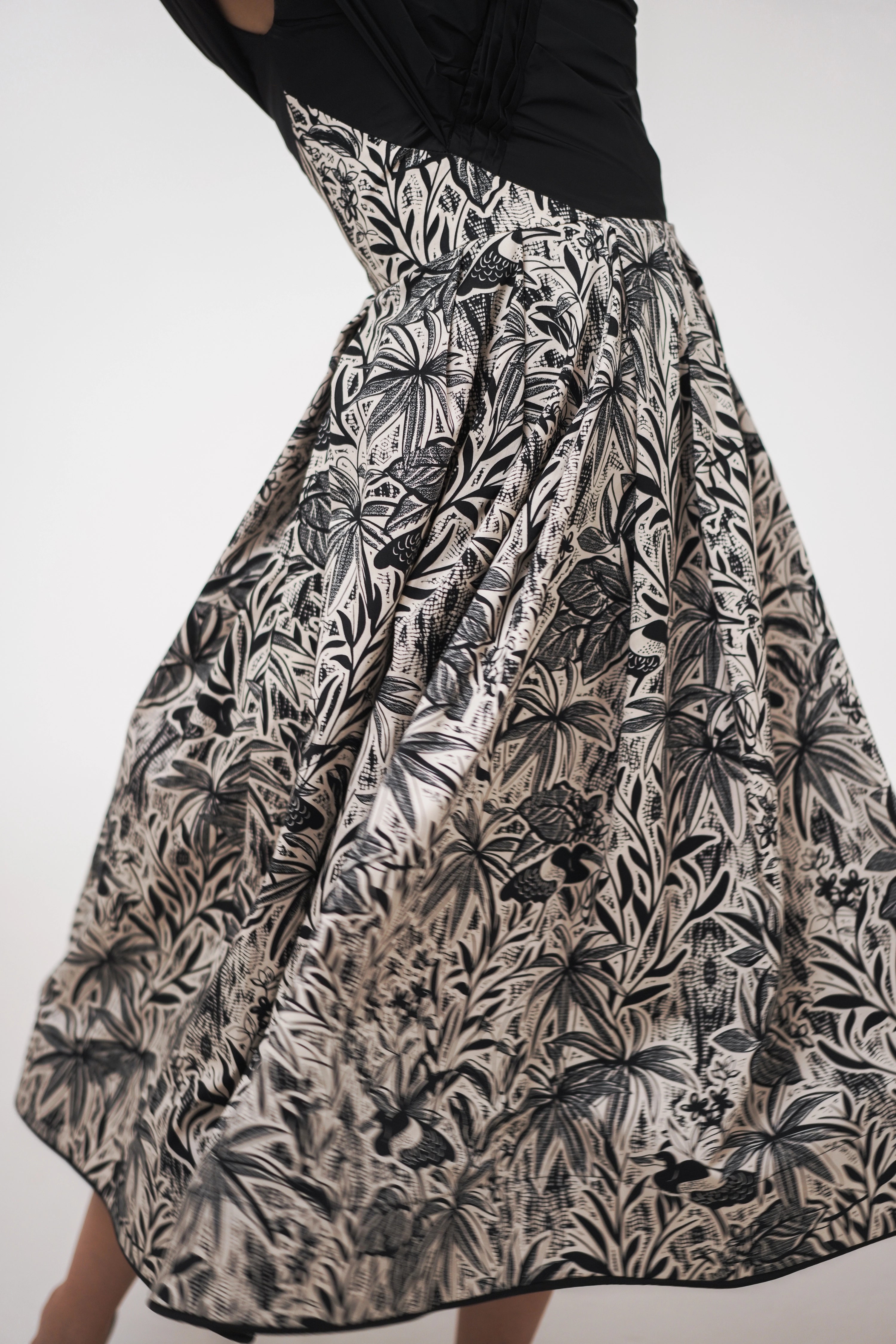 Woman wearing La Muse Nocturne Dress from Mimaussy Paris, studio close-up of dress details against a plain white background