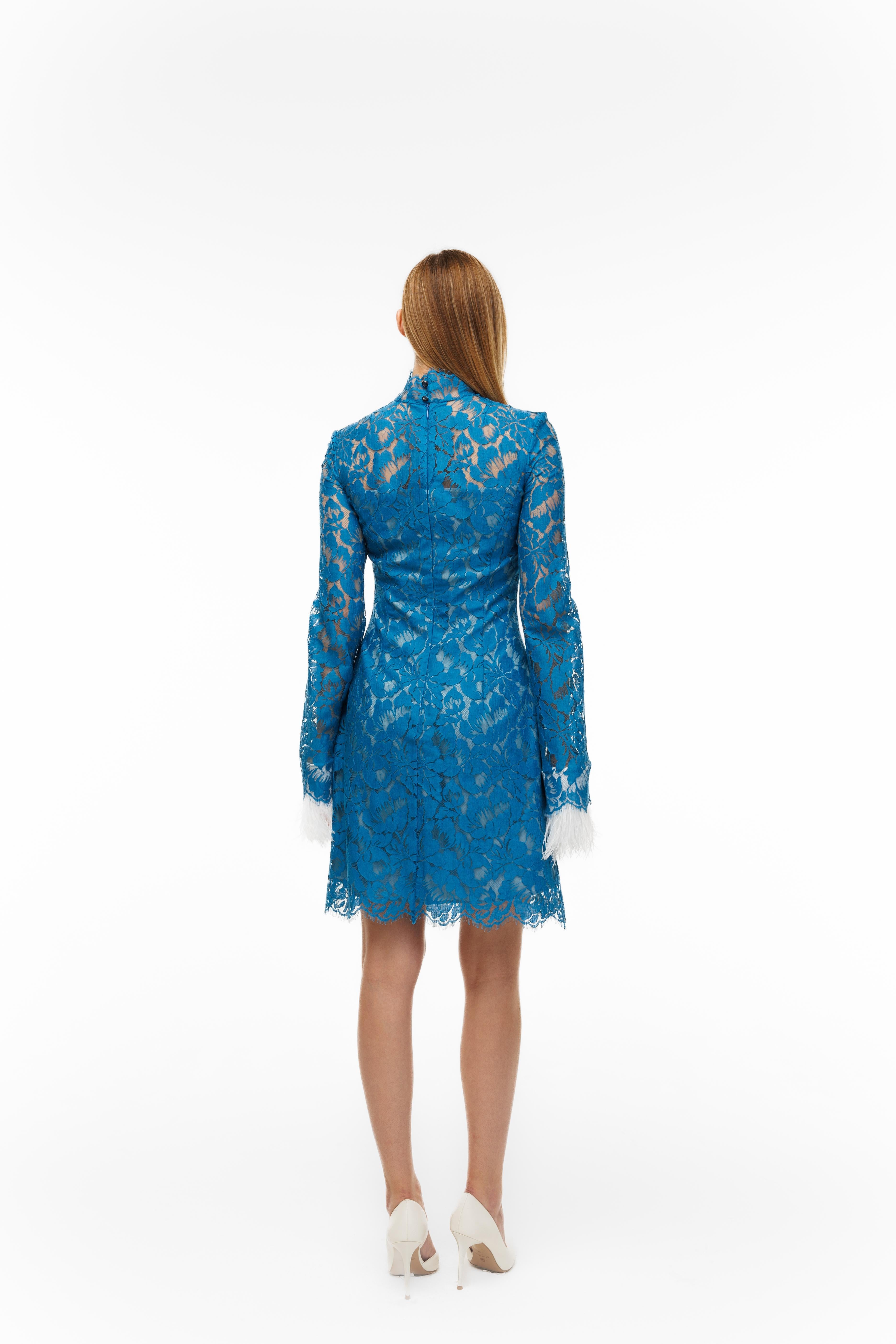 Blue lace dress on a white background