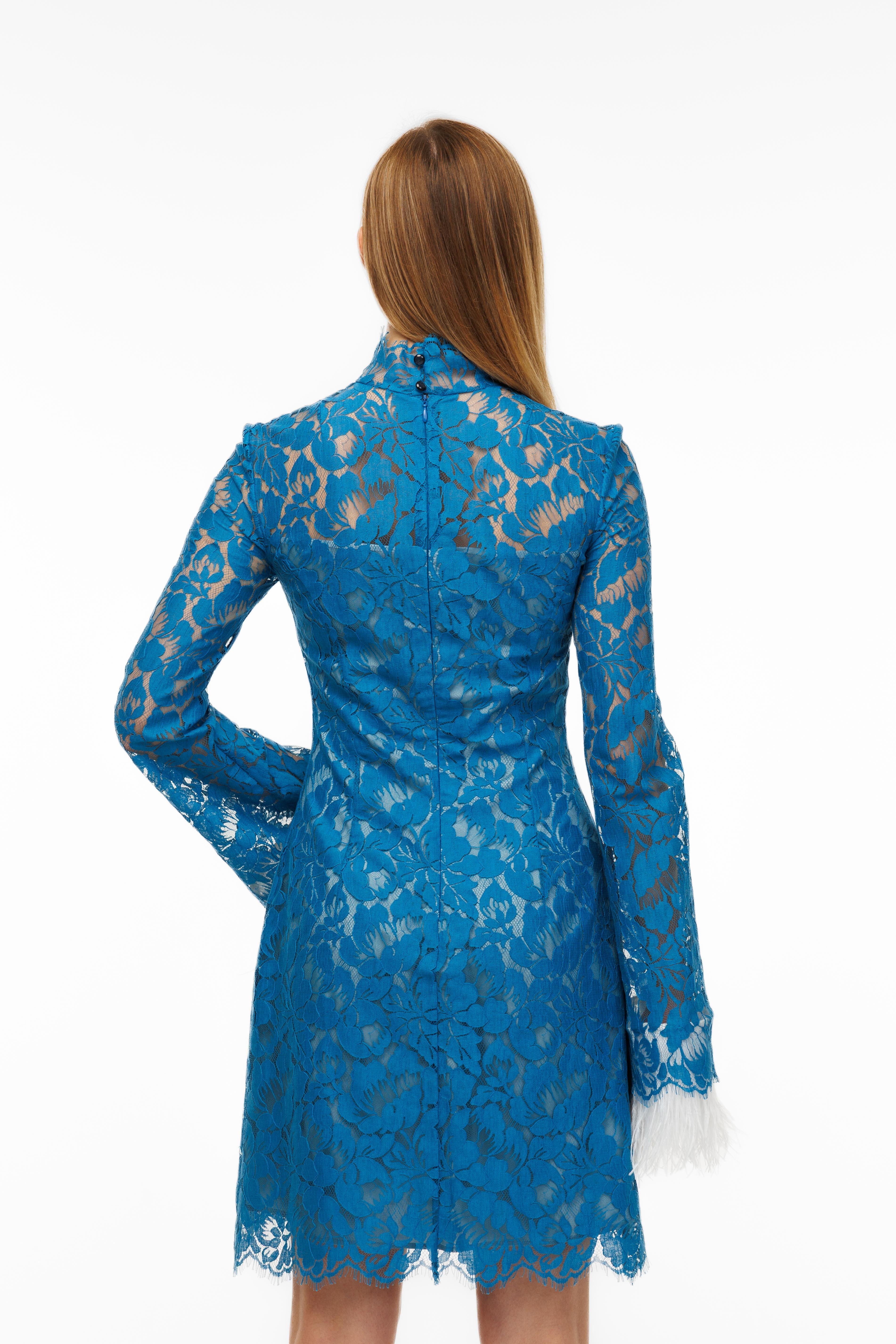 Blue lace dress on a white background
