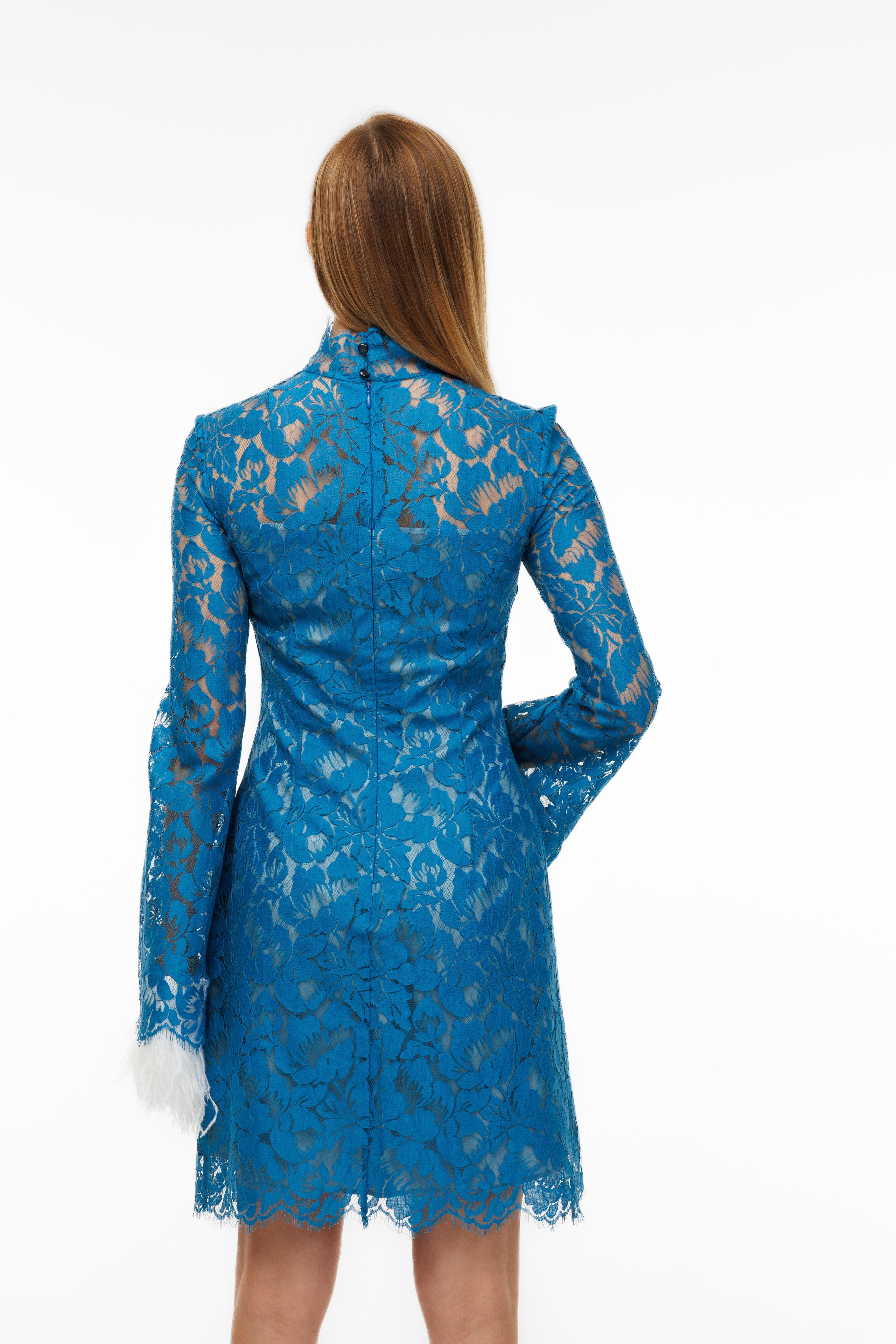 Blue lace dress on a white background