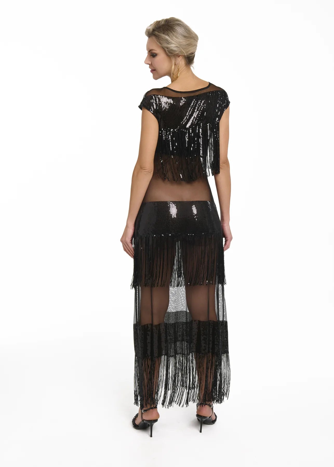 Back view of a woman in a black sequin dress, the Midnight Charleston Dress in Black Diamond from Mimaussy Paris.