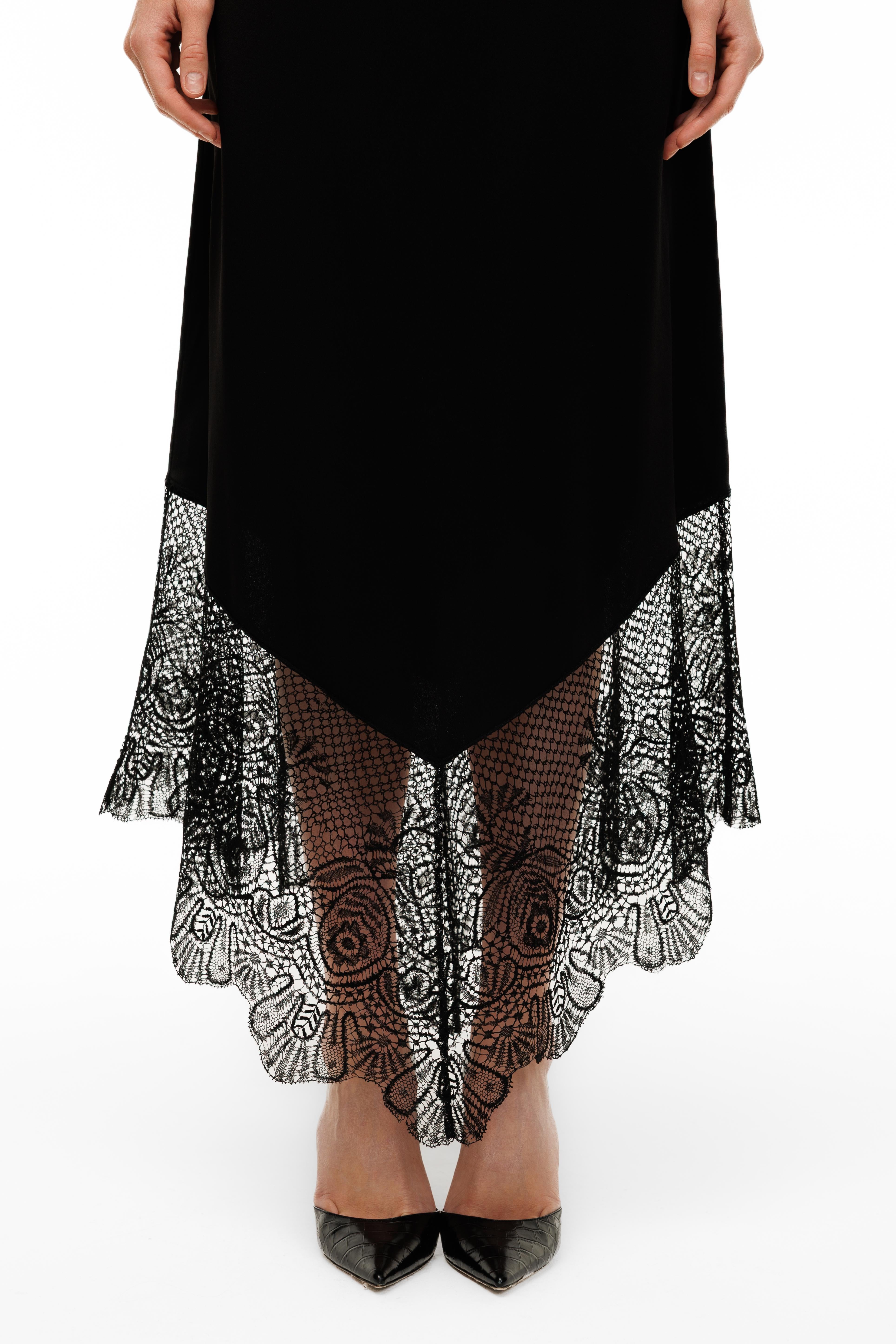 Black dress with lace detailing on a white background