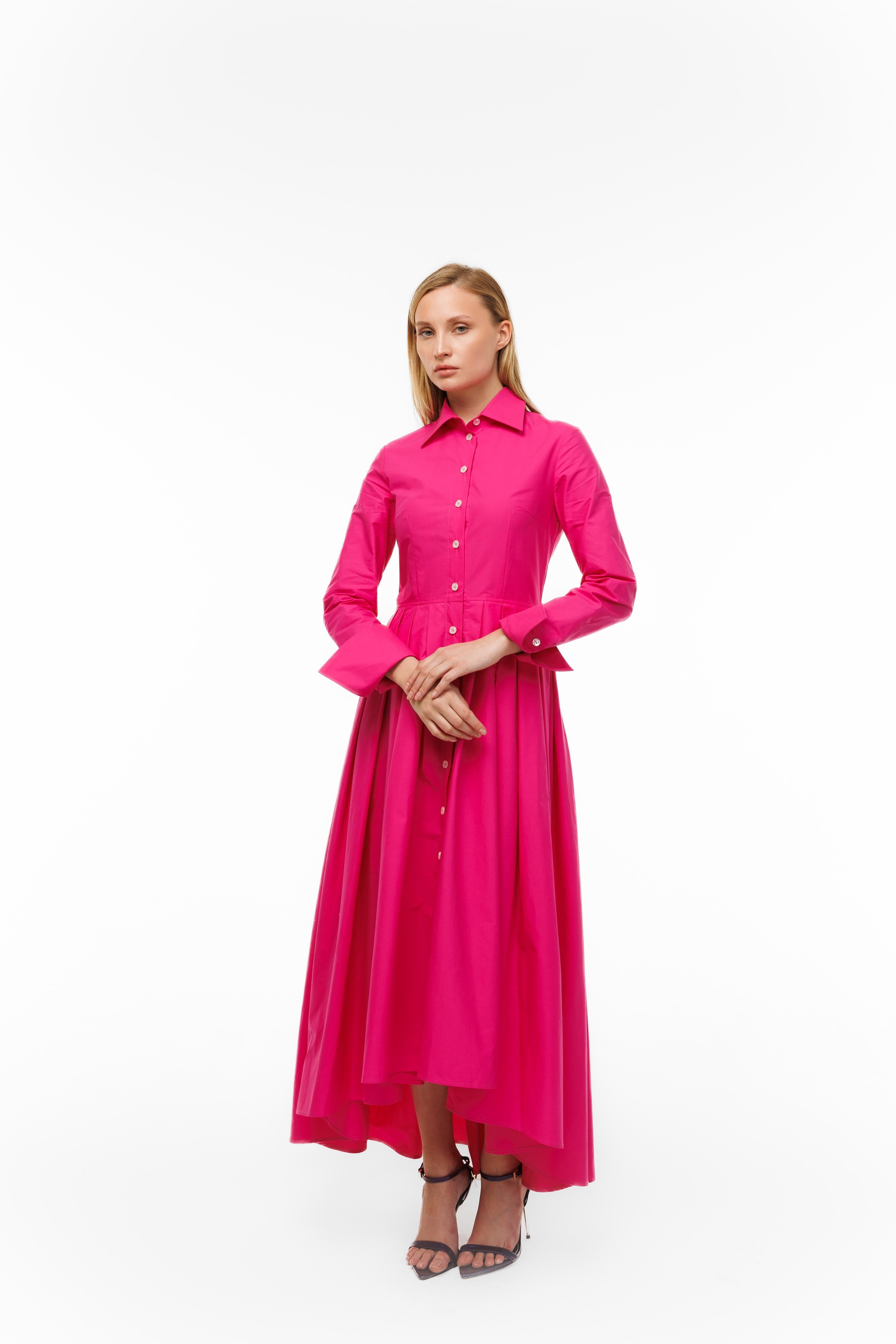 Woman wearing a pink dress on a white background