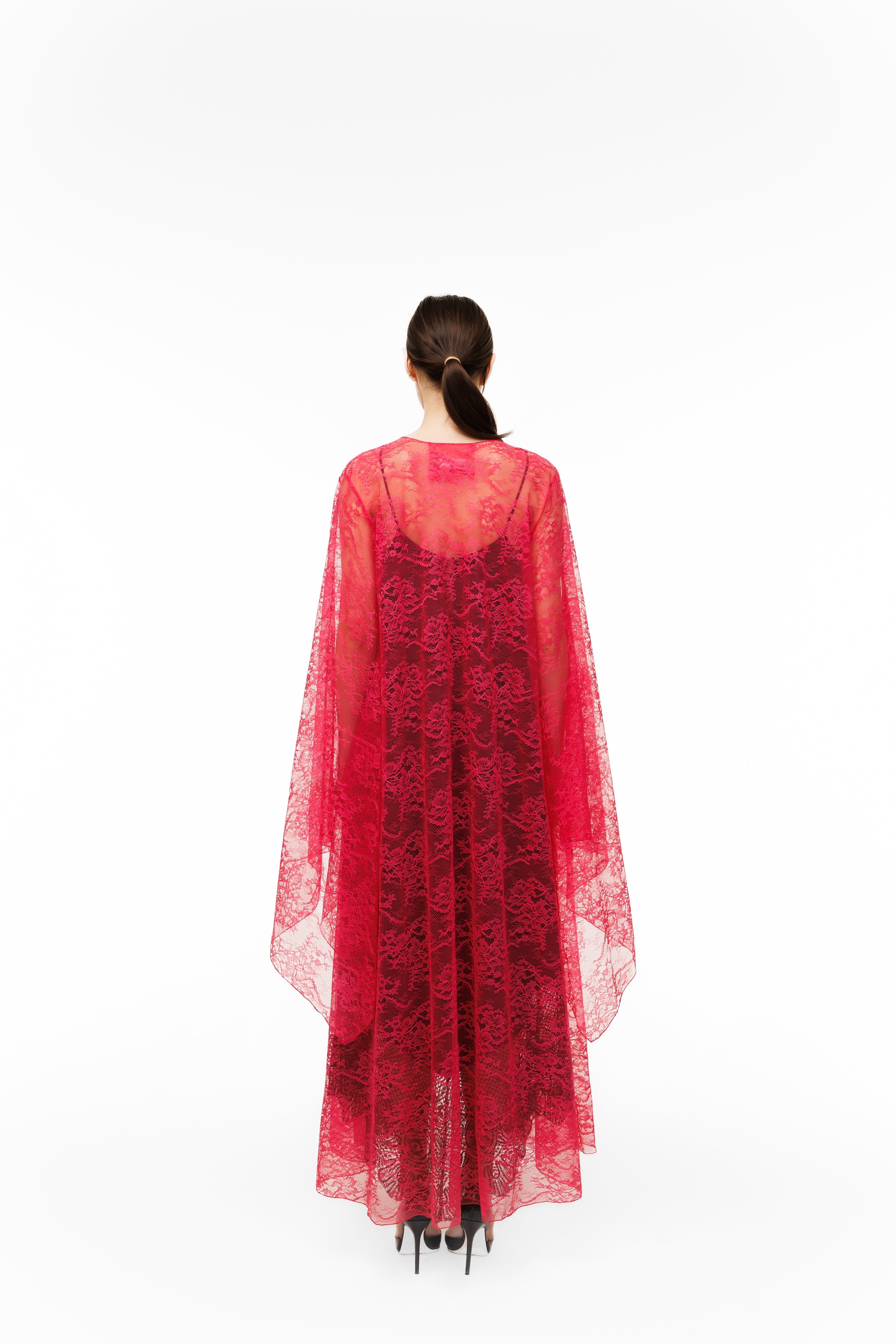 Red lace dress with sheer overlay on a white background