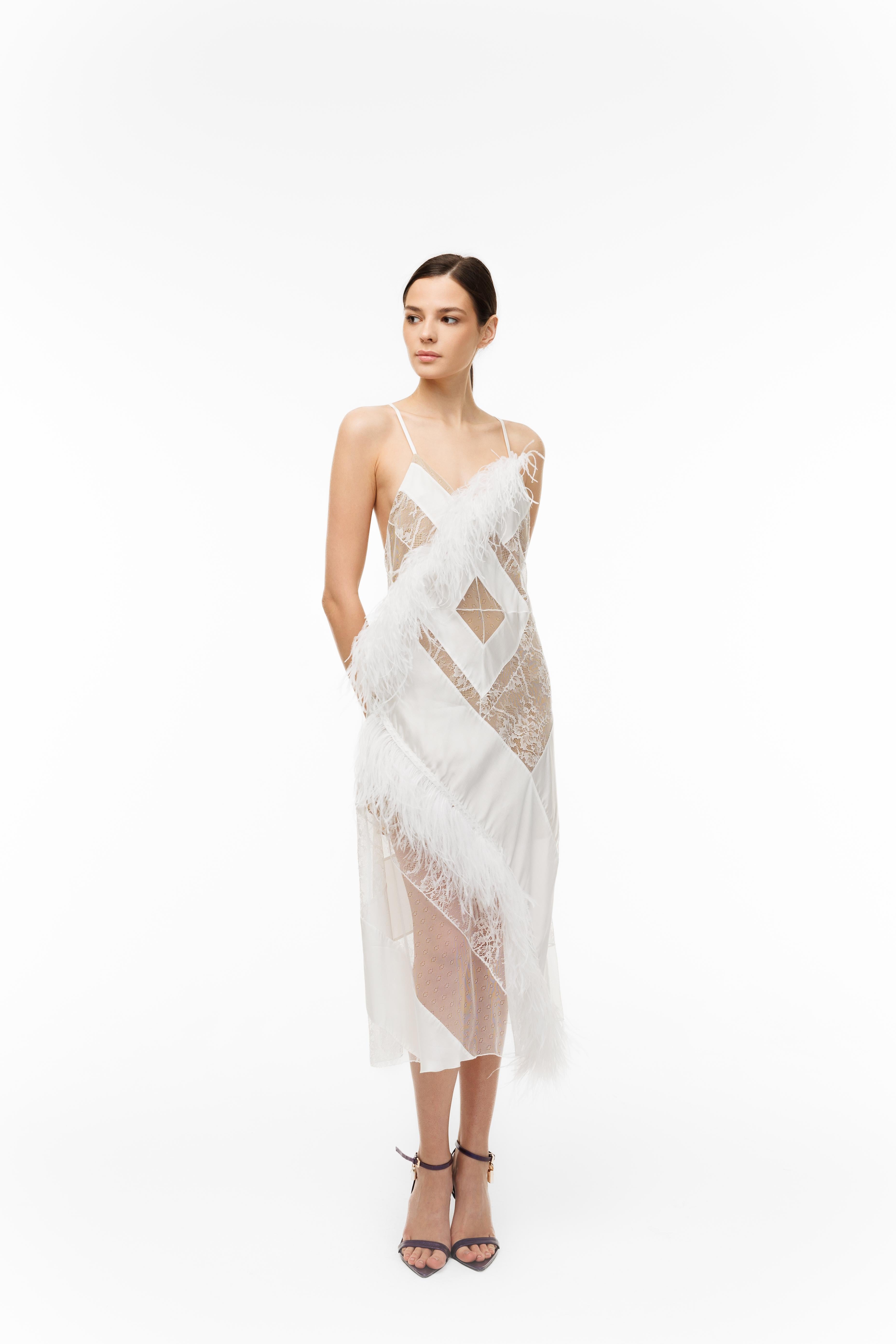 Woman wearing a white lace dress on a white background