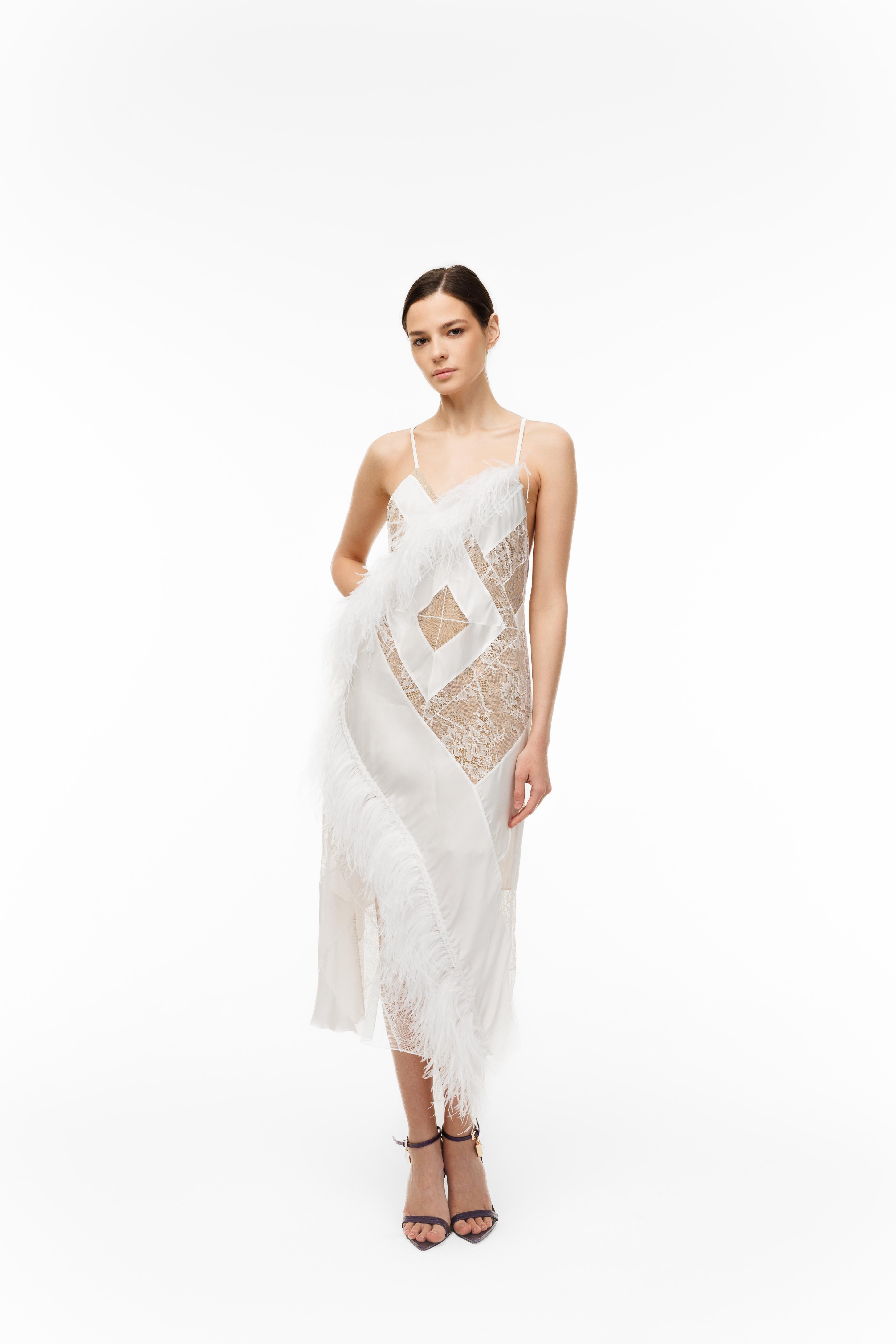 Woman wearing a white lace dress on a white background