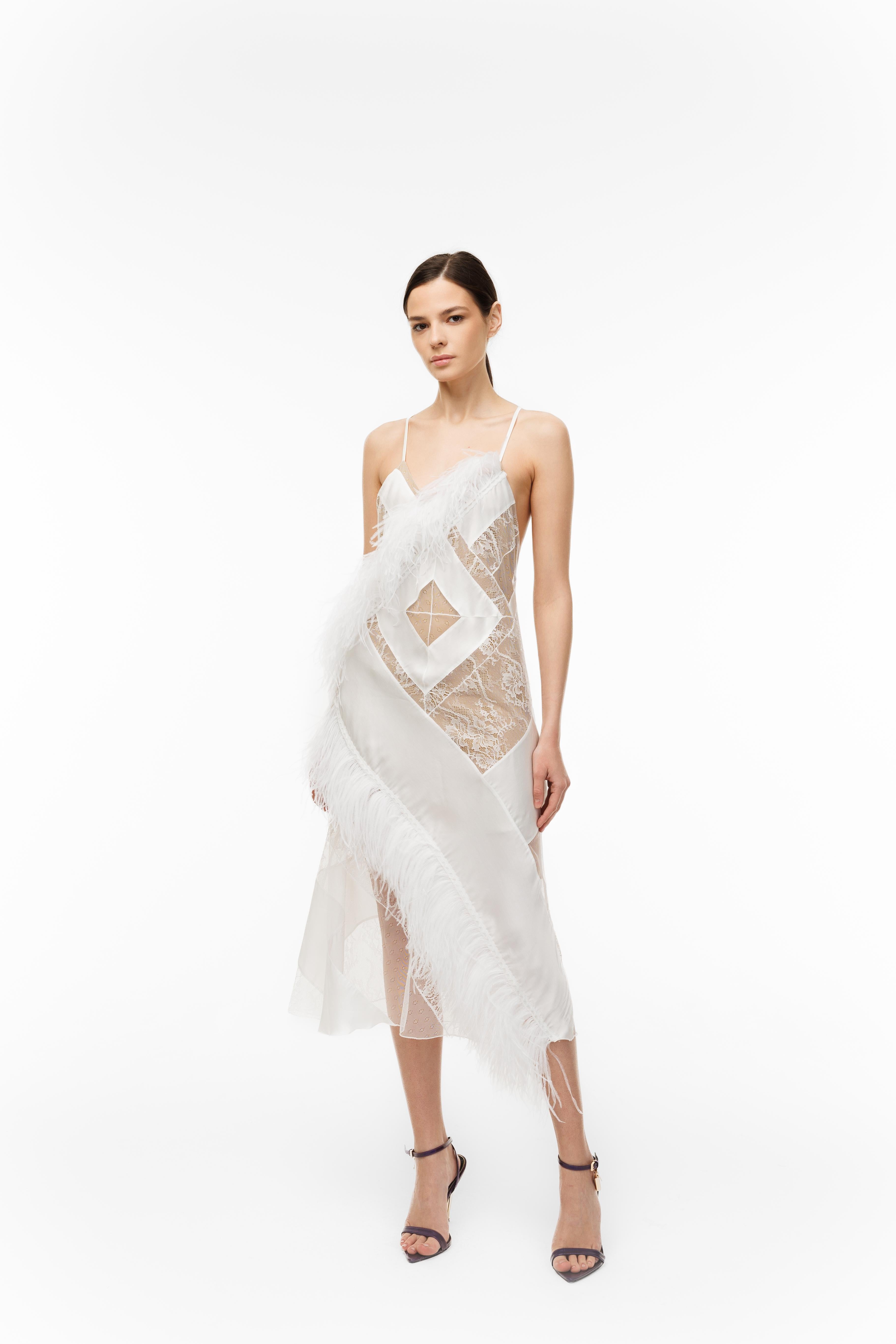 Woman wearing a white lace dress on a white background